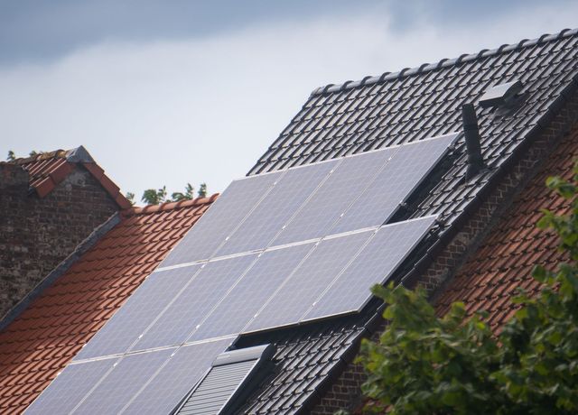 Solar panels on a tiled roof in the sunshine